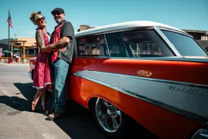Jenn and Joe McElmurry pose with their classic Chevrolet Bel Air at the Ignite the Nites car show in Libby, Montana.
