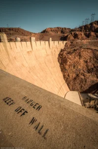 A wide-angle warning on the upper walkway of Hoover Dam.
