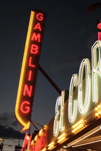 An old-school, bulb-and-neon sign beckoning gamblers into the historic El Cortez Hotel & Casino. Las Vegas, Nevada.