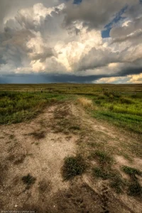 Thundershowers develop over a section line in the rural North Dakota countryside.