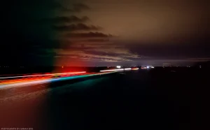 Early winter clouds mirror the light trails of vehicles on I-94 in North Dakota.