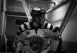 Moody black and white portrait of Bismarck Bobcats forward Jakub Kopecky.