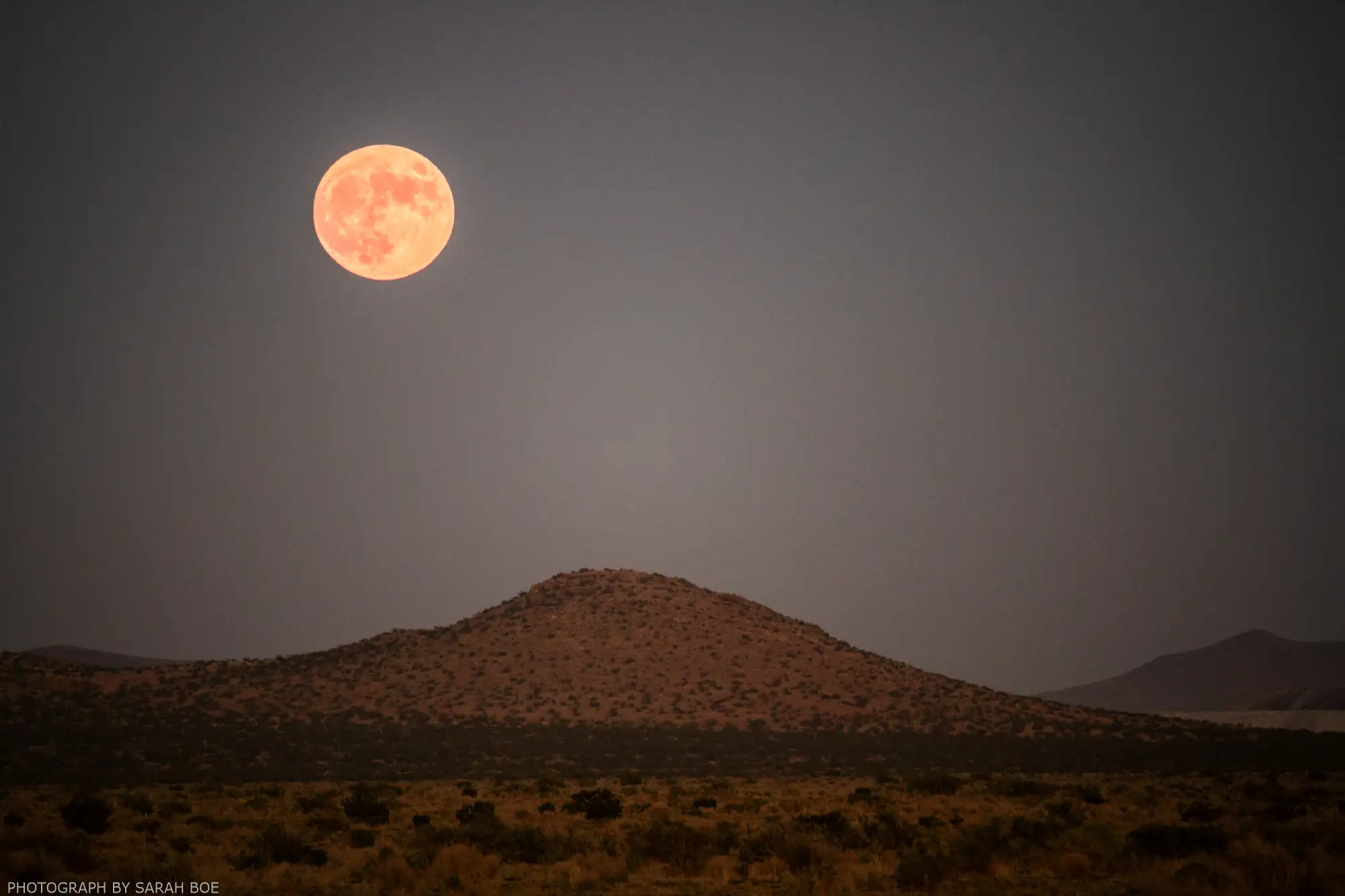 The full moon rises over the Mojave Desert at Wasteland Weekend.