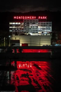 A rainy night in the red neon glow of an industrial warehouse area in north Portland, Oregon.