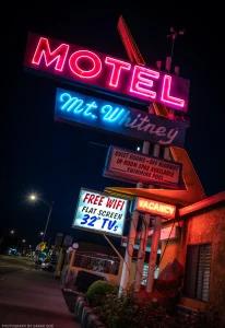 The classic neon sign of a motel in Lone Pine, California, sandwiched between the highest and lowest elevation in the contiguous United States.