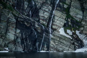 Geological forces leave an abstract work of art in the mountain walls at Leigh Lake in the Cabinet Mountain Wilderness.