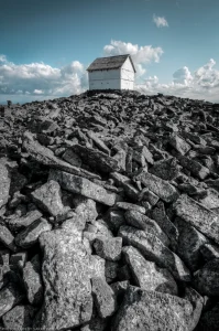 The lookout on top of Northwest Peak (northwest Montana), where it sits upon an almost-Arctic-looking rock field.