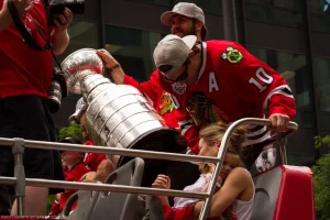 Brent Seabrook, Patrick Sharp, and surrounding family celebrate Chicago’s 2015 Stanley Cup championship.