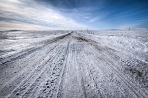 A familiar drive with cold, cold vibes, buried in a specific kind of winter belonging to rural nowhere, North Dakota.