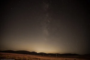 The Milky Way dives down into the airglow of distant Los Angeles.